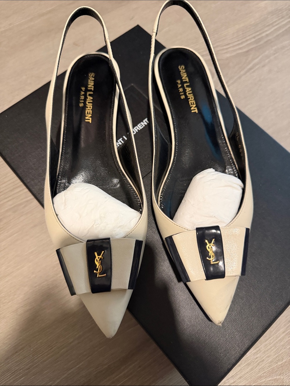 Saint Laurent Cream Pointed Slingback Flats with Black Bow and Gold YSL